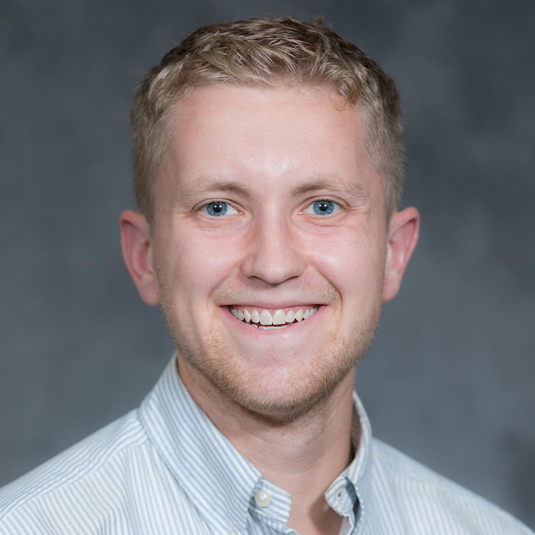Professional headshot of Chris Dade